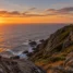 Farol do Cabo Finisterre ao pôr do sol, destino do trecho Santiago, Finisterre e Muxía